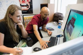 Pixar expert Dan Nguyen helps a student with character animation.