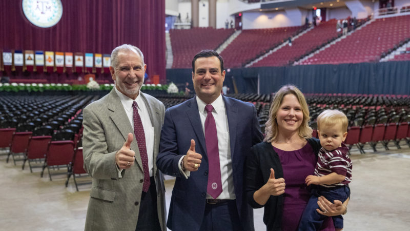 Texas A&M President Michael K. Young met with Jordan, Amanda and Jason Enger after graduation.
