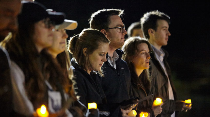 Bush School student organizations hosted a candlelight vigil Saturday night on Bush Library and Museum grounds. (Butch Ireland for Texas A&M)