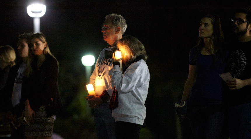 Bush School student organizations hosted a candlelight vigil Saturday night on Bush Library and Museum grounds. (Butch Ireland for Texas A&M)