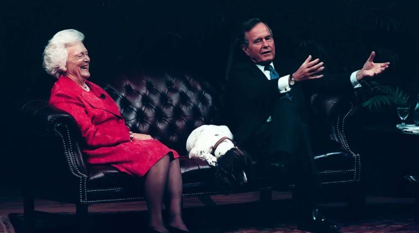 a photo of George and Barbara Bush sitting on a couch