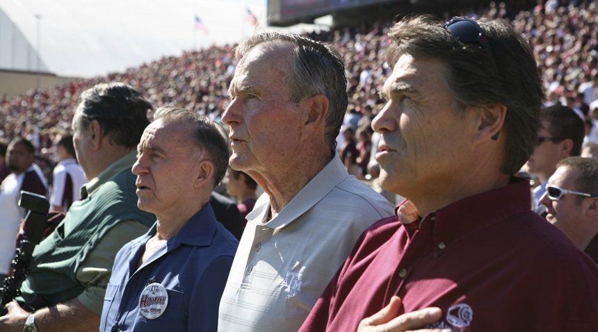 Former Texas Governor and Current Energy Secretary Rick Perry joins President Bush in singing the National Anthem at Kyle Field. (Texas A&M Marketing & Communications)