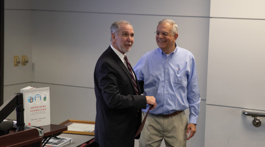 President Young surprised Dr. Paul Busch with the Presidential Professor for Teaching Excellence Award during class.