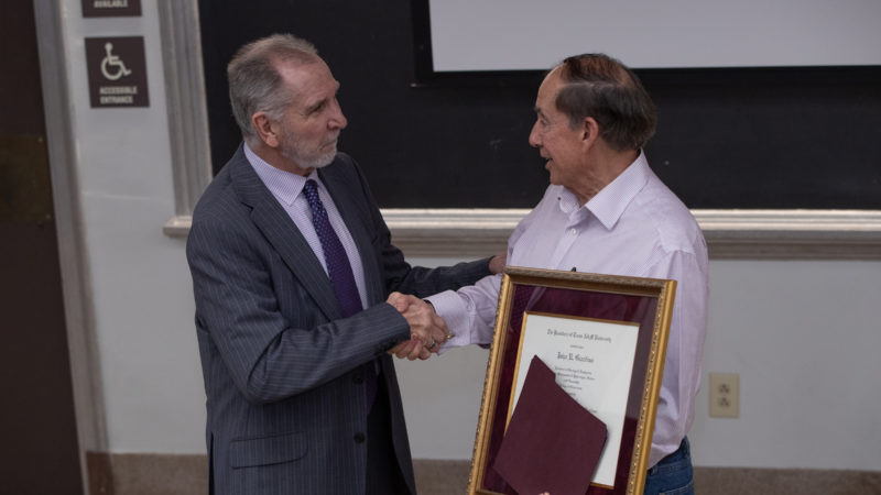 President Young surprised Dr. Rick Giardino with the Presidential Professor for Teaching Excellence Award during class.