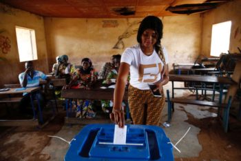 A woman casts her ballot at a polling station during a runoff presidential election in Bamako, Mali on Aug. 12, 2018. 