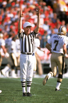 Referee Red Cashion signals a score during a game between New Orleans Saints and the San Francisco 49ers at Candlestick Park on December 11, 1988 in San Francisco, California.