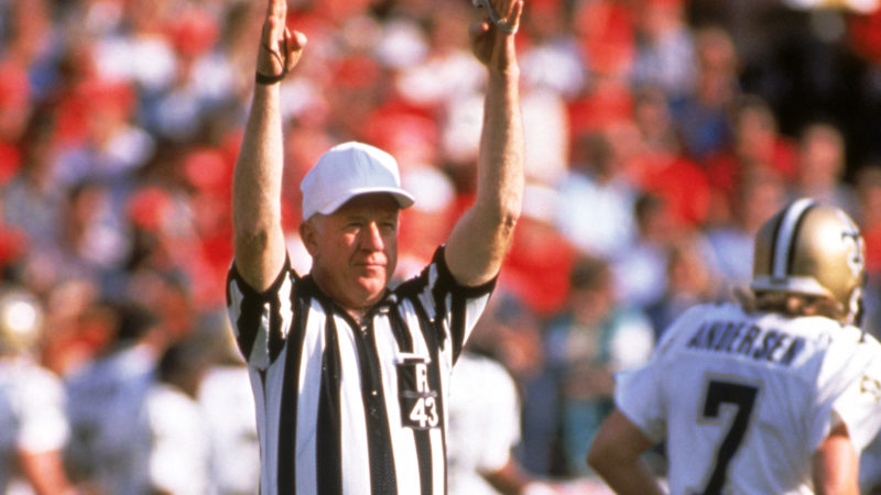 Referee Red Cashion signals a score during a game between New Orleans Saints and the San Francisco 49ers at Candlestick Park on December 11, 1988 in San Francisco, California.