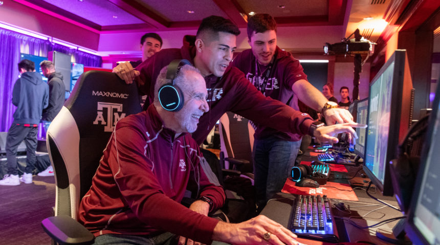 Texas A&M President Michael K. Young plays Fortnite at the Texas A&M [Power] House during SXSW.