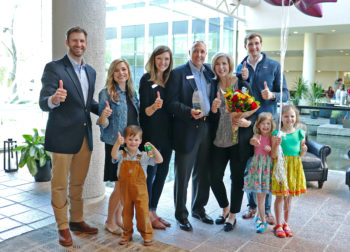 Preston and Susan Abbott surrounded by their children and grandchildren after the surprise announcement at the Omni Hotel Westside in Houston that they are the Texas A&M Parents of the Year.
