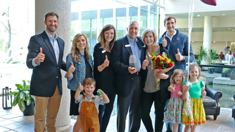 Preston and Susan Abbott surrounded by their children and grandchildren after the surprise announcement at the Omni Hotel Westside in Houston that they are the Texas A&M Parents of the Year.