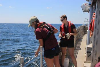 Victoria Scriven and a fellow oceanography student conduct field work on a cruise aboard the R/V Manta, a NOAA vessel.