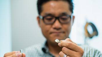 Texas A&M University assistant professor Sung Il Park holds the wireless surgical lighting device he developed.