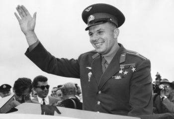 Russian cosmonaut Major Yuri Gagarin waves to a crowd