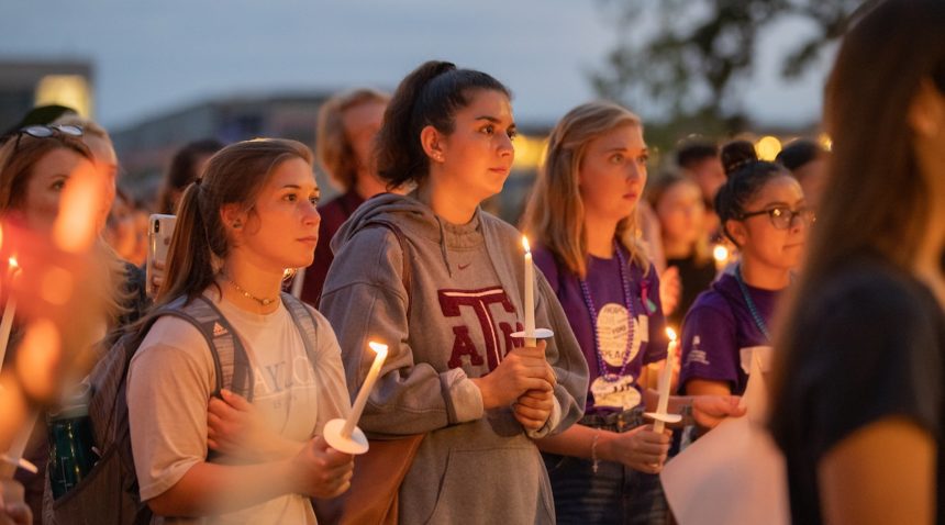 holding candles at 2019 ‘Not Another Aggie’ Suicide Awareness Walk