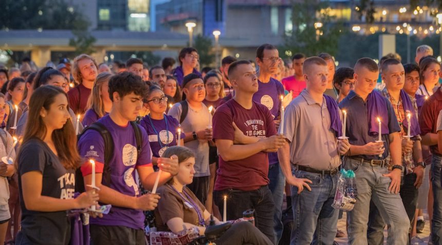 holding candles at 2019 ‘Not Another Aggie’ Suicide Awareness Walk