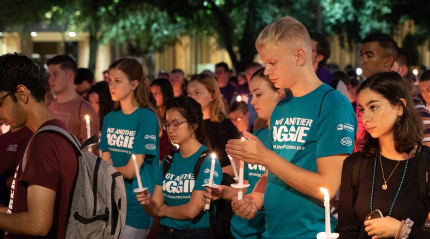 holding candle at 2019 ‘Not Another Aggie’ Suicide Awareness Walk