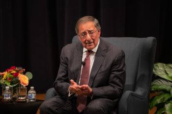 Leon Panetta sits on a stage at the Annenberg Presidential Conference Center