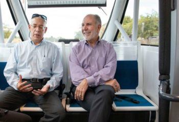 TTI Senior Research Scientist Bob Brydia explains the technology behind the autonomous shuttle to Texas A&M President Michael Young as they ride around Texas A&M’s campus Sept. 25.