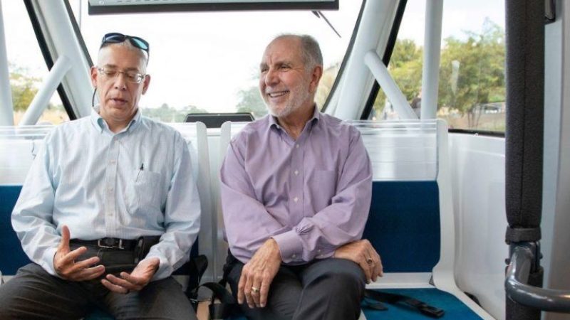 TTI Senior Research Scientist Bob Brydia explains the technology behind the autonomous shuttle to Texas A&M President Michael Young as they ride around Texas A&M’s campus Sept. 25.