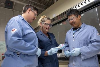 Texas A&M scientists Ashlee Jahnke, Karen Wooley and Peter Hai Wang, working in the Wooley Laboratory.