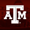 Texas A&M Logo in front of Academic Building