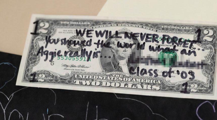 Dollar bill with note written for Bonfire victims