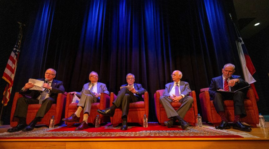 Five panelists sit on a stage at the Bush Library