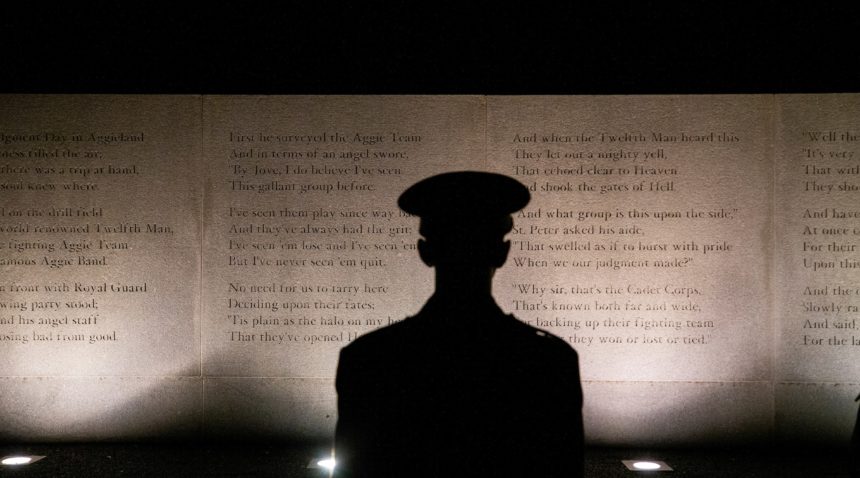 cadet silhoutted at the bonfire remembrance ceremony