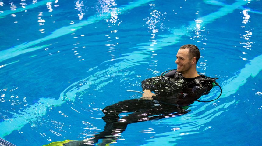 Aaron Cranford in scuba gear in a pool