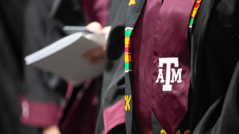 a close up image of a graduation stole with the texas a&m logo