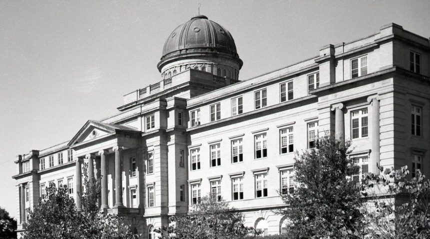 a black and white photo of the Academic Building