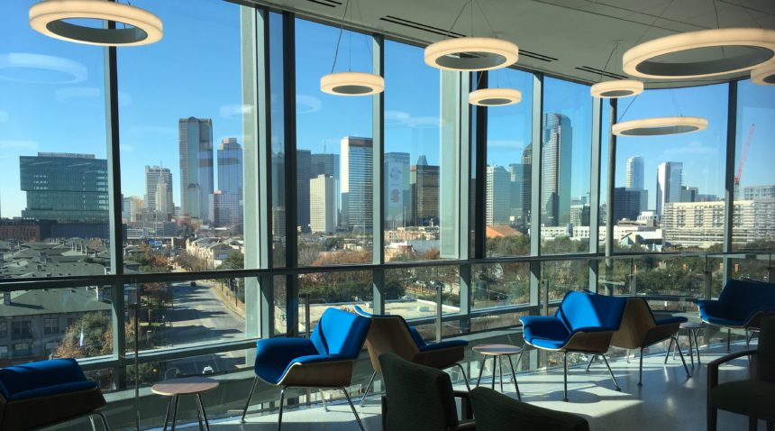 interior view of a waiting area in the new clinic building looking out on the dallas skyline
