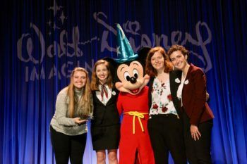 students pose with mickey mouse