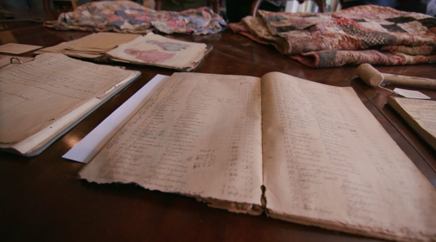 Documents laying on a table that are associated with a Freedom Colony.