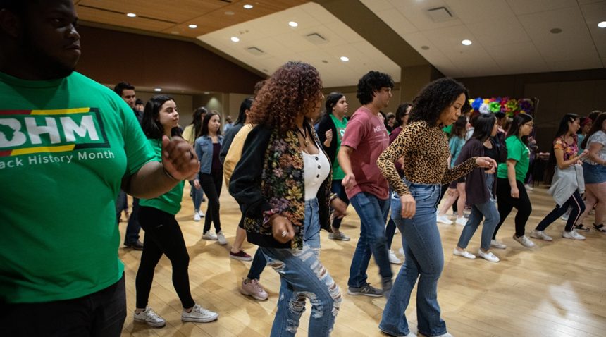event attendees participating in a salsa dance lesson