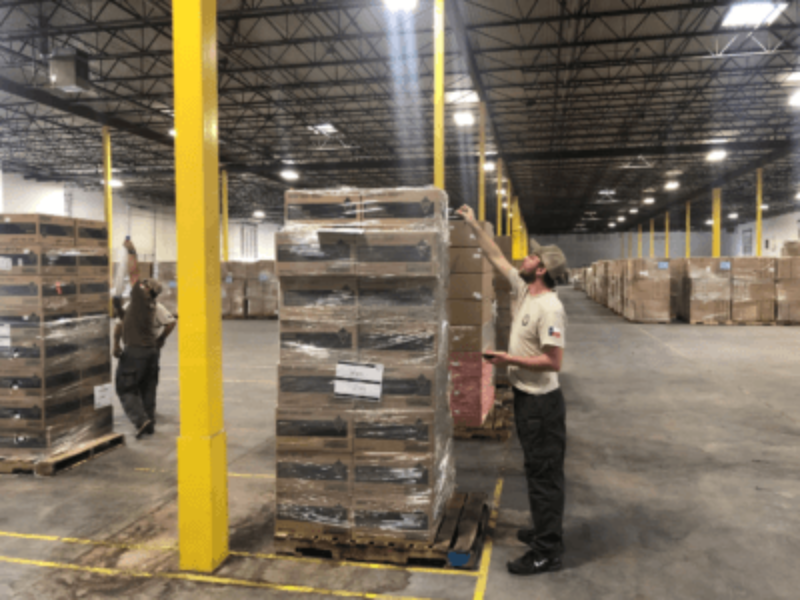 man standing in warehouse