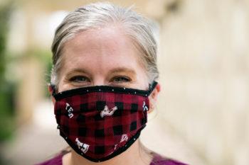 close-up image of doctor wearing maroon facial mask