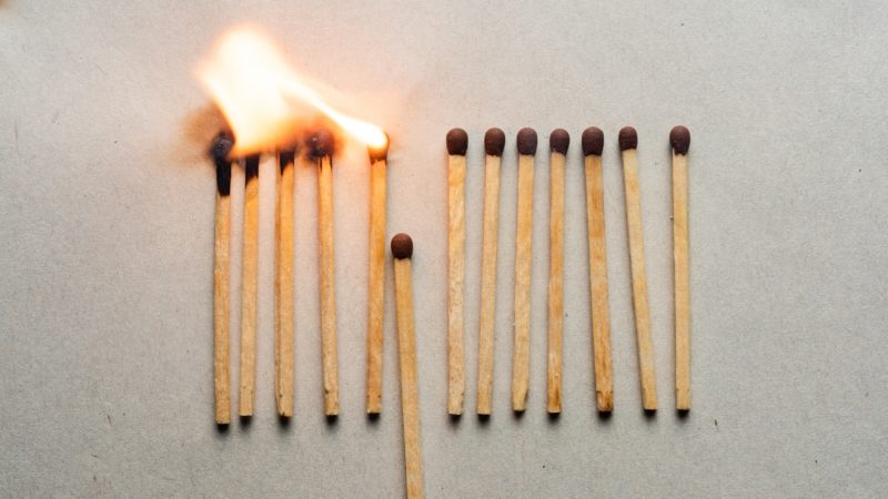 a row of matches, some on fire separated by those without a flame