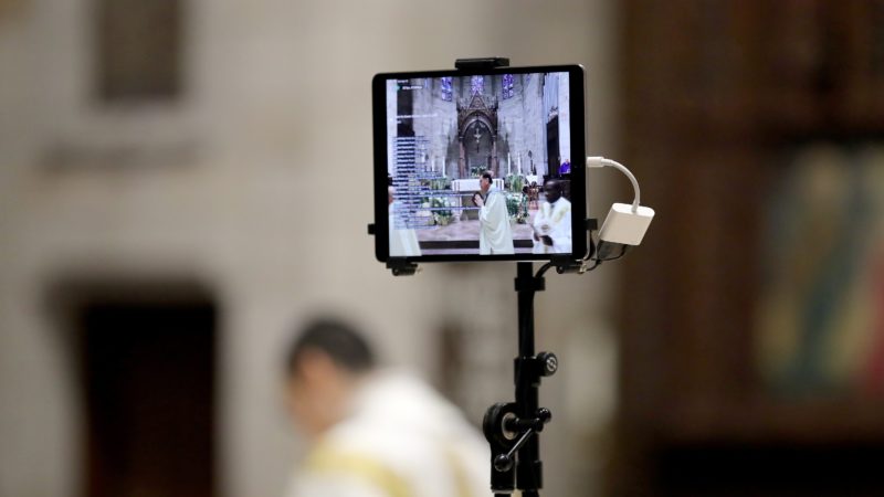view of a livestream on an ipad of a catholic church mass