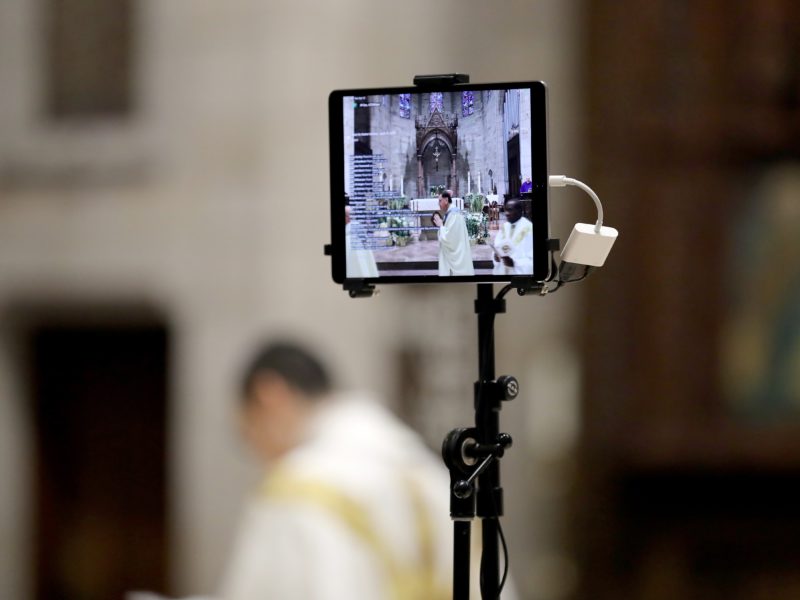 view of a livestream on an ipad of a catholic church mass
