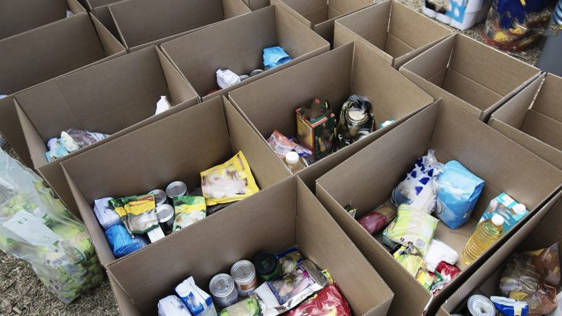 a photo of cardboard boxes filled with food donations