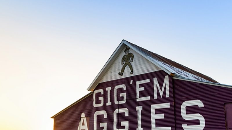 A photo of the Aggie Barn with the words Gig 'Em Aggies
