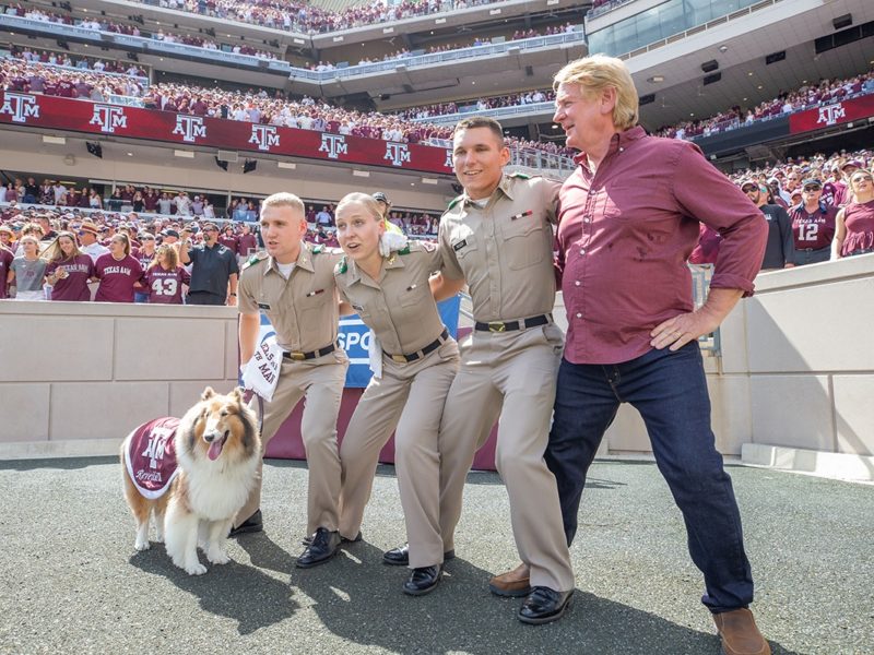 a photo of Reveille IX, Bill Farmer, Colton Ray and two other cadets sawing 'em off at the Texas A&M-Auburn football game on Sept. 21, 2019