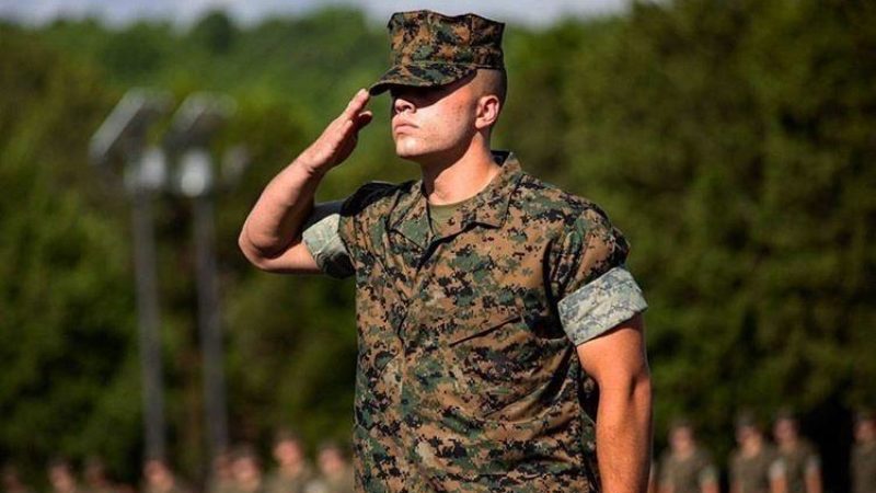 Cadet Dopp saluting in his fatigues