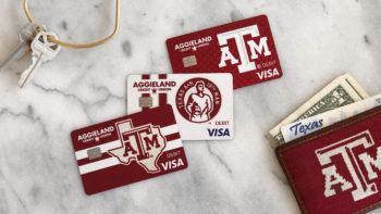 image of aggieland credit union cards spread out on a marble counter