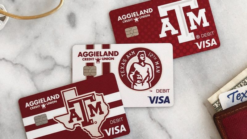 support aggieland text graph over image of aggieland credit union cards on a counter