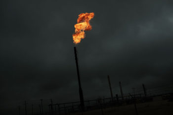 flared natural gas against dark sky