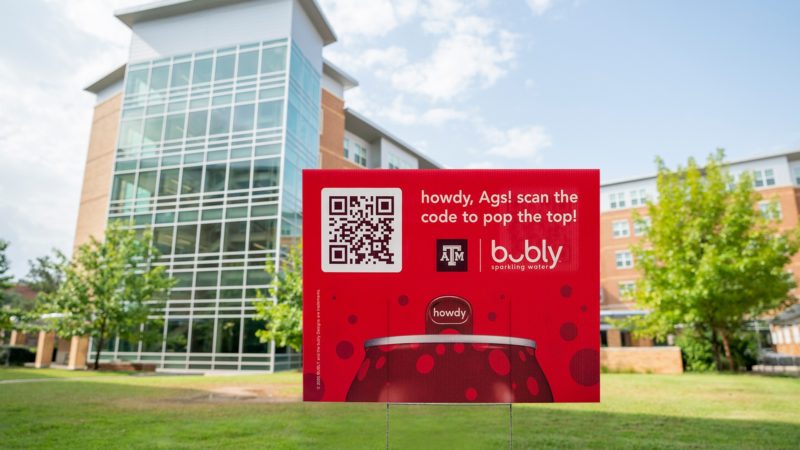 a Howdy Bubly sign with QR code