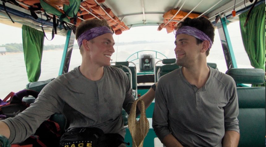 a photo of Will Jardell and James Wallington riding on a boat in Brazil
