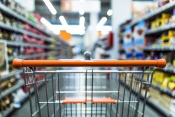 Abstract blurred photo of store with shopping cart in grocery store